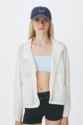 Enavant Sheer lace layered button-up windbreaker in the color Ivory
